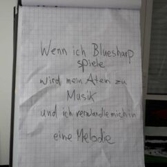 Bild zeigt ein Flipchart mit dem Ausspruch: Wenn ich Bluesharp spiele wird mein Atem zu Musik und ich verwandle mich in eine Melodie